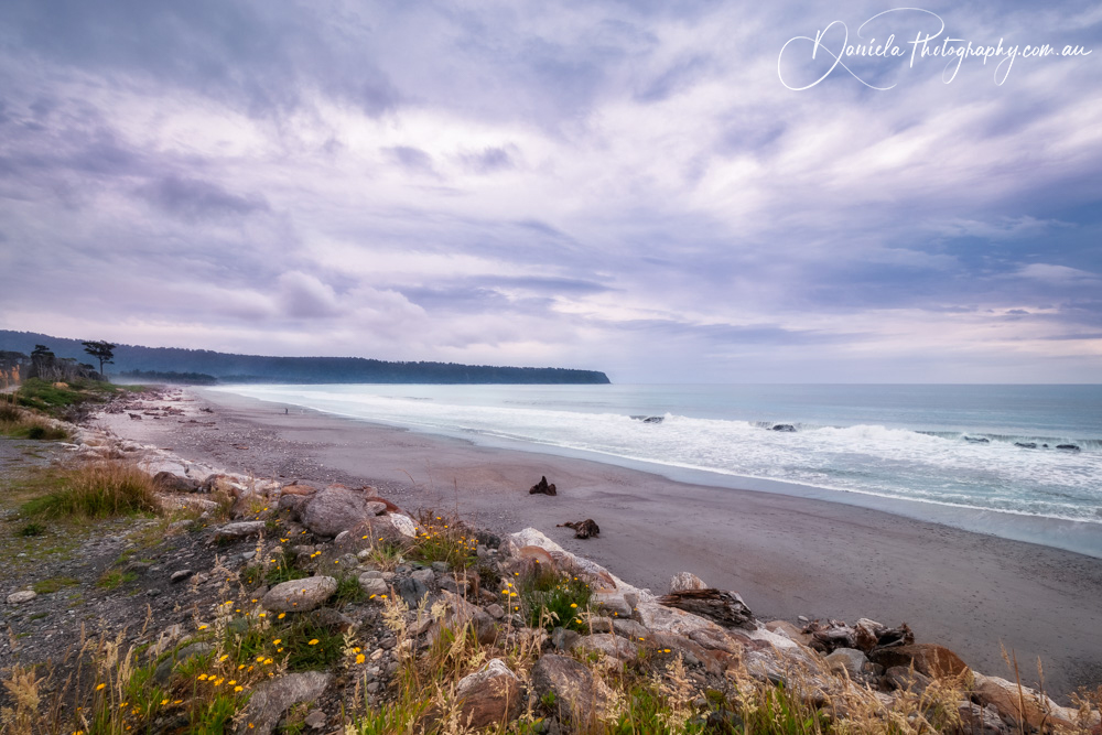 New Zealand Sunset at a picturesque ocean beach at Bruce Bay